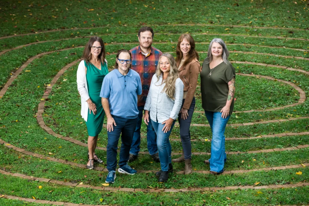 Widening Circles Staff standing on grass