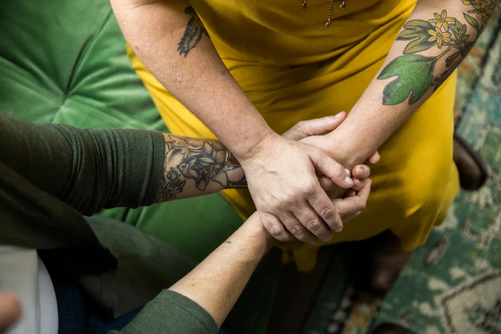 two women holding hands