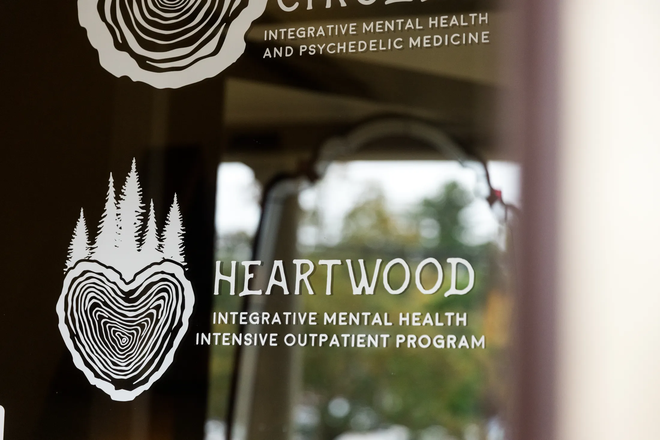 Heartwood Sign on glass